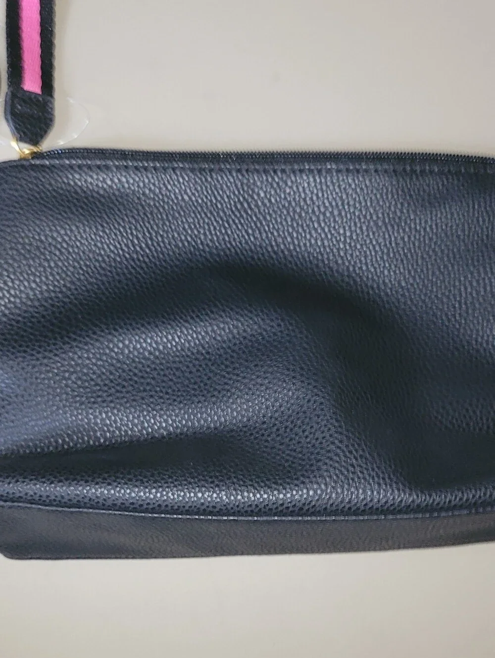 NWT - Perry Ellis Black Wristlet with Pink Trim.